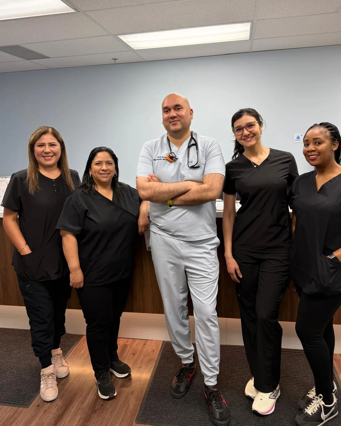 Holy Cross Family Medicine Clinic care team standing together in the clinic